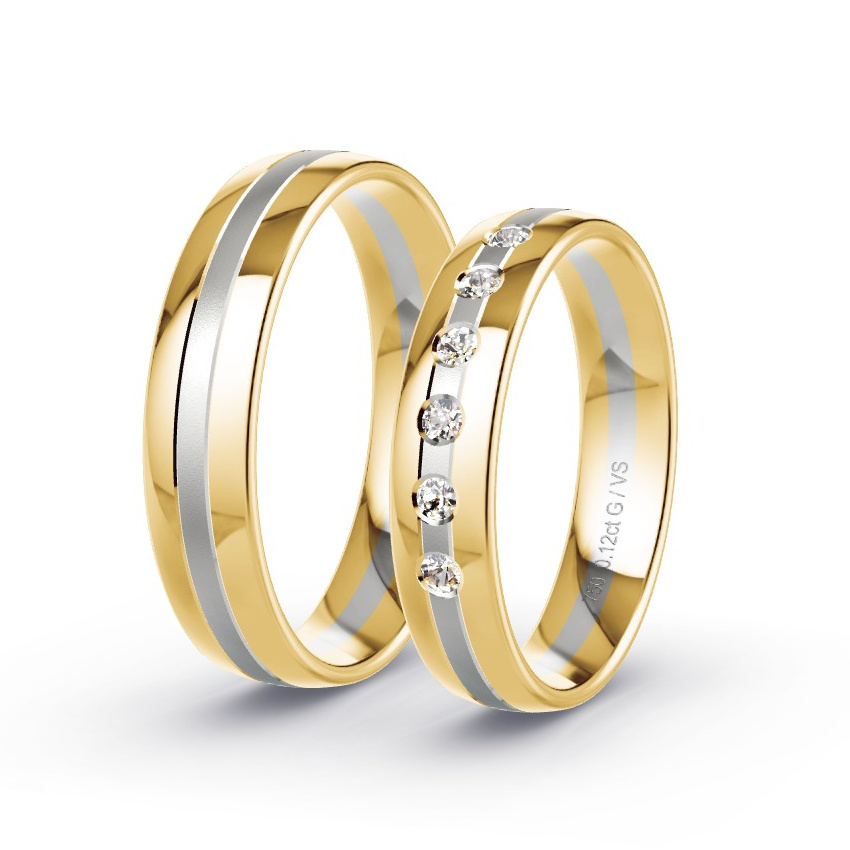 Alianzas de matrimonio hecha en oro con piedras preciosas en el centro